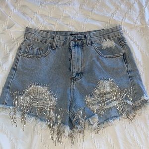 Denim shorts with rhinestone fringe
